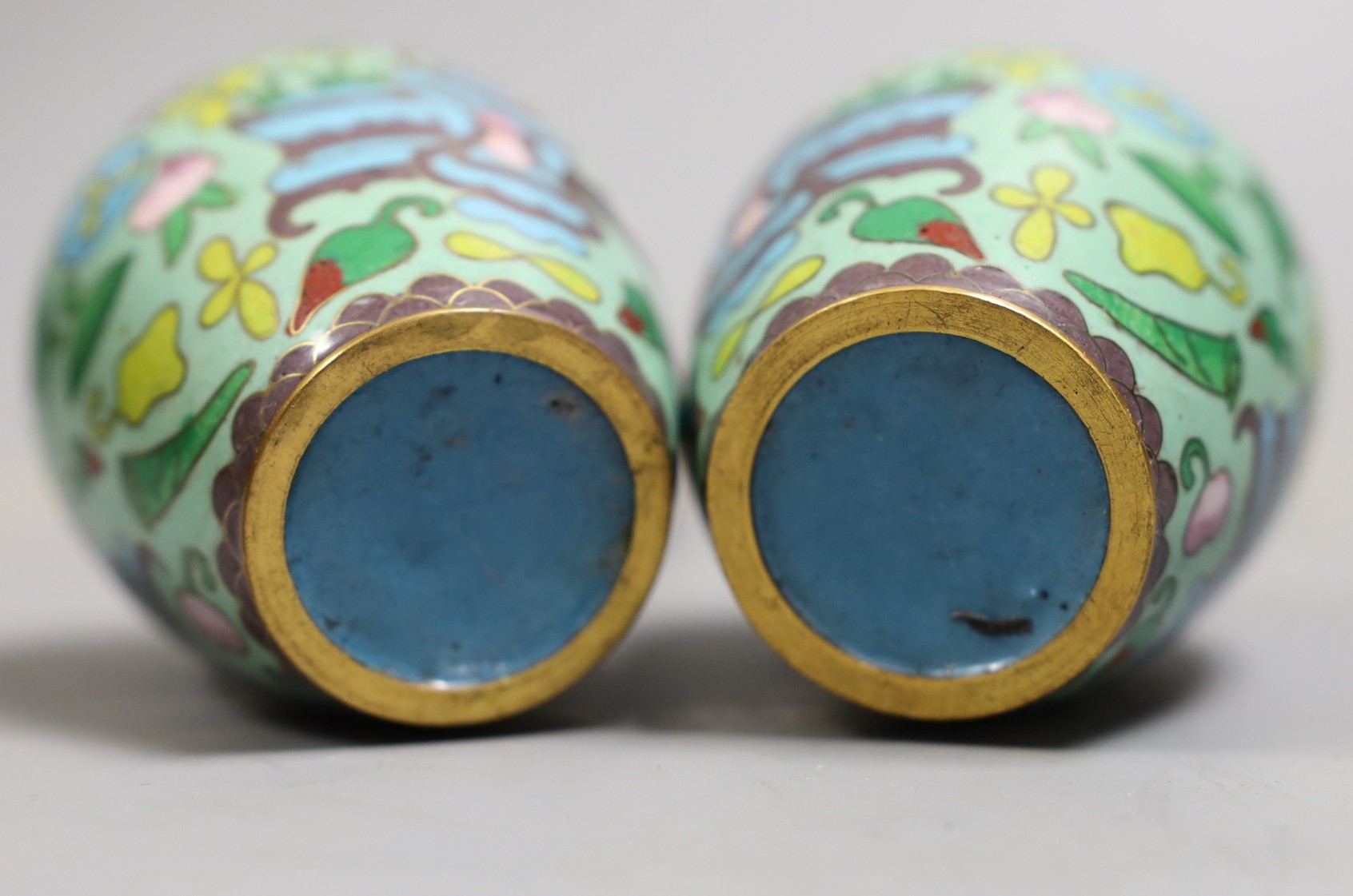 A pair of Chinese cloisonné enamel jars, wood stands, 9cm